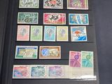 a display of stamps on display in a glass case