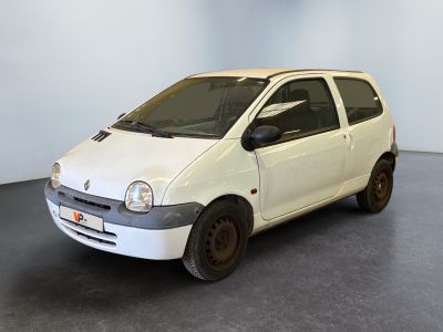a small white car that is parked in a room