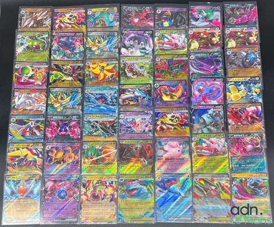 a close up of a bunch of pokemon cards on a table