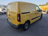 the yellow van is parked in a parking lot with other cars