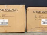 two boxes that are sitting on the ground next to each other
