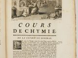 un livre ouvert sur lequel figure l'image d'un homme et d'une femme dans une cuisine