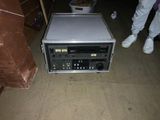 a microwave that is sitting on the floor next to a box