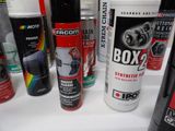 many different types of spray paint on the counter