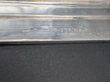 an image of a piece of metal with writing on it