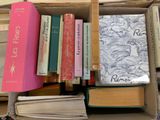 a box full of books that are sitting on the floor