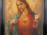 a painting of jesus holding the sacred heart of jesus
