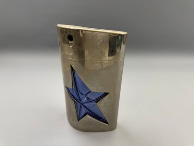 a silver lighter with a blue star on it