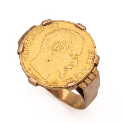 an image of a gold coin ring with a woman ' s face on it