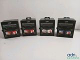four boxes of camera film sitting on a table next to each other