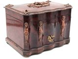 a wooden box with carvings on it on a white background