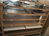 many shelves that are stacked together in a room