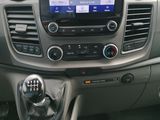 the dashboard of a car with a gps device in the center of it