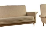 two chairs and a couch sitting next to each other on a white surface