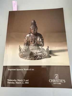 a book with a picture of a buddha statue on it