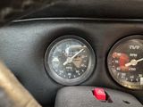 two gauges on the dashboard of a car