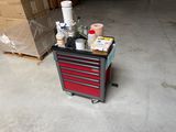 a cart with a lot of supplies on it in a garage