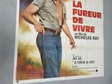 a poster of a man with a gun in his hand