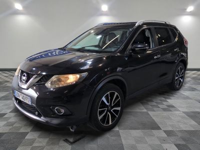 the black nissan suv is parked on a checkered floor