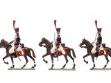three figurines of men in uniforms riding on horses