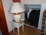 a lamp that is sitting on a table in a room