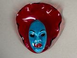 a blue mask with a red hat on it