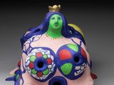 a figurine of a woman with a crown on her head