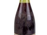 a bottle of wine that is sitting on a table