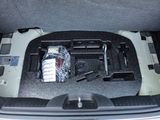 the trunk of a car with a bunch of items inside of it
