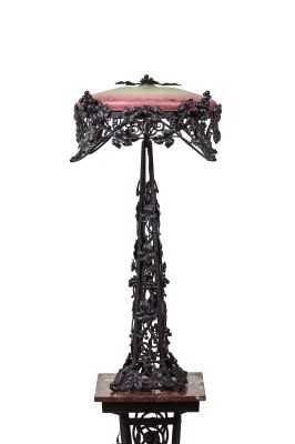 a table with a lamp on top of it on a table