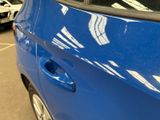 a close up of a car door handle with a sticker on it