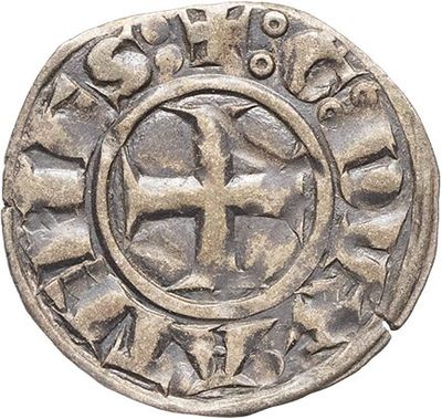 a silver coin with a cross in the center of it