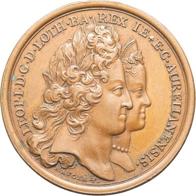 une image représentant une pièce d'or sur laquelle figurent la tête d'une femme et un papillon