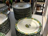 many plates that are sitting on a table