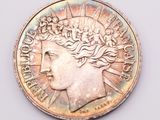 an image of a close up of a coin on a white surface