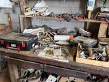 a workbench with many tools on it in a garage