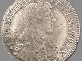 une pièce d'argent portant une tête de femme et une couronne