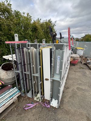 a pile of metal and other items in a yard