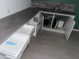 a kitchen with a sink and cabinets in it
