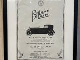 an old black and white picture of a car in a frame