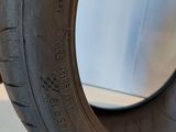 a close up of a tire on a white surface