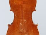 an old violin with a wooden back and bow on a white background