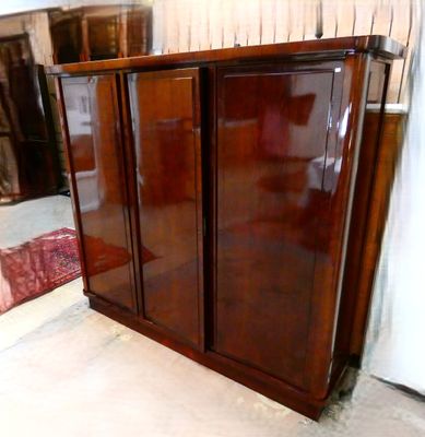 an image of a large wooden cabinet in a room