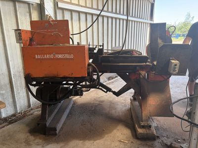 an image of a man working on a machine in a garage