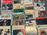 a lot of music cds on the table together
