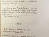 someone is holding a book open to a page with an image of a clock on it