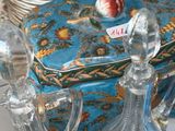 three glass vases sitting on a table next to a blue box