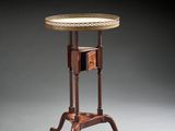 a small table with a wooden top and a wooden base