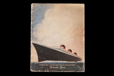 a book with a picture of a large boat in the water