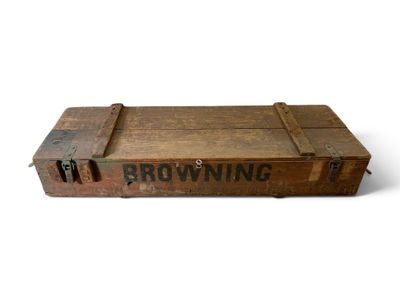 an old wooden crate with browning on it sitting on a white surface
